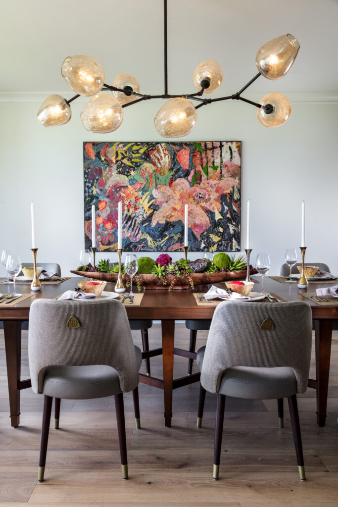 Statement Lighting in this transitional, modern dining room.