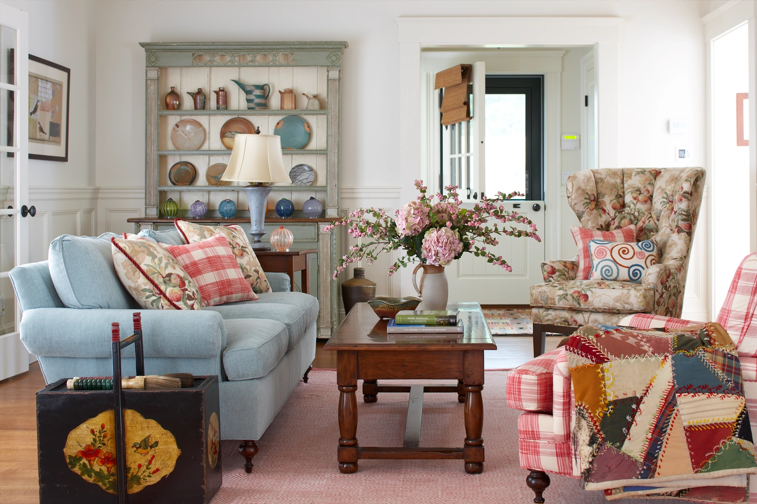 Eclectic living room with antiques, fall colors and patterns.